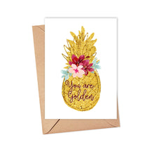 Load image into Gallery viewer, The "You are Golden Pineapple Thank You Card or Friendship Card" from R is for Robo features a glittering gold pineapple with vivid flowers and the elegantly scripted phrase "You are Golden." Complemented by a brown envelope, this card exudes gratitude and warmth, making it perfect for any occasion.