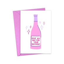 Load image into Gallery viewer, Featuring an illustration of a pink wine bottle, the "Rose' All Day Birthday Card for Wine Lover" by R is for Robo is presented on a white card with the phrase "Rosé All Day for Your Birthday." This humorous card is ideal for wine enthusiasts and comes with a pink envelope. It's surrounded by colorful stars against a white backdrop.