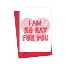 Load image into Gallery viewer, A heavyweight matte card from R is for Robo showcases a red heart and bold text declaring I AM SO GAY FOR YOU. This LGBTQ Funny Anniversary Card is paired with a red envelope, set against a plain white background, awaiting your personalized message.