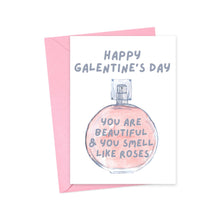 Load image into Gallery viewer, A delightful "You Smell Like Roses Galentine's Day Card" by R is for Robo, enclosed in a pink envelope with a whimsical illustration of a perfume bottle, contains a heartfelt handwritten message inside: "Happy Galentine's Day. You are beautiful & you smell like roses.
