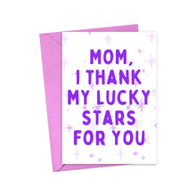 Load image into Gallery viewer, Check out the "Thank my Lucky Stars for You" cute Mother's Day card from R is for Robo. It features a purple envelope and a heavyweight matte finish. The front of the card displays the message "Mom, I thank my lucky stars for you" in bold purple letters against a light background sprinkled with small stars.