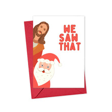 Load image into Gallery viewer, This playful Christmas card features Santa and Jesus with the text "We Saw That." It’s designed to add humor and charm to holiday greetings, combining traditional figures with a cheeky twist. The card measures 4.25 x 5.5 inches, printed on heavyweight matte paper, and comes with a red envelope.