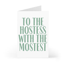 Load image into Gallery viewer, A heavyweight matte card from R is for Robo stands open, showcasing the text "To the Hostess with the Mostest" in large, green letters on a white background. The Hostess with the Mostest Thank You Card is perfect for adding a personal touch with a handwritten note.