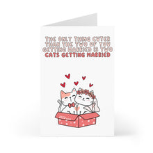 Load image into Gallery viewer, The "Cat Wedding Card" by R is for Robo is a funny wedding card for cat lovers, featuring the text: "The only thing cuter than the two of you getting married is a cat wedding." Below, two cartoon cats with hearts above their heads sit in a box labeled "Happily Ever After," making it a cute and humorous addition to your celebration.