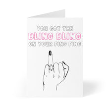 Load image into Gallery viewer, The Ring Finger Funny Engagement Card by R is for Robo showcases a humorous hand flipping the bird with a shiny ring. It playfully features the words "You got the BLING BLING on your FING FING" in pink and black text, adding a cheeky twist to your handwritten message.