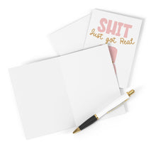 Load image into Gallery viewer, A blank greeting card from R is for Robo is open, showing its plain white interior. In the background, a closed card titled "Shit Just Got Real Funny Engagement Card" displays a humorous message perfect for an engagement ring. A black and white pen with gold accents lies diagonally across the card.