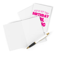 Load image into Gallery viewer, An open greeting card accompanied by a pen rests on a white surface. Partially visible behind it is another card from R is for Robo, featuring the bold pink text "You've Got That Birthday Girl Magic," ready to be personalized with a hand-written note to complete this thoughtful gesture.