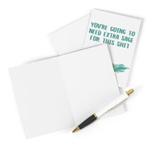 Load image into Gallery viewer, A blank open card and a pen rest beside the Sage Funny Sympathy Card by R is for Robo, featuring the text "YOURE GOING TO NEED EXTRA SAGE FOR THIS SHIT" alongside an illustration of sage leaves.