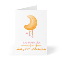 Load image into Gallery viewer, The "Over the Moon Baby Card" by R is for Robo features a heavyweight matte finish and showcases a crescent moon embellished with heart-shaped ornaments. The card includes the message, "I am over the moon for you and your little one." It's an ideal choice for including a heartfelt, handwritten note inside.