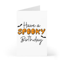 Load image into Gallery viewer, The October Birthday Halloween Card from R is for Robo is a white card that stands upright, showcasing the text "Have a Spooky Birthday" in black and orange dripping letters, with two small black bats fluttering around the words against a plain white background.
