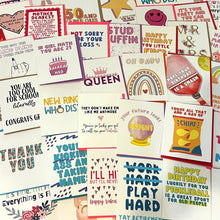 Load image into Gallery viewer, A vibrant assortment of R is for Robo&#39;s Oops Seconds Greeting Cards - Slightly Imperfect Cards is beautifully displayed. These charming cards come in various sizes and feature an array of designs, including birthday wishes, humorous phrases, and playful illustrations like crowns, flowers, and smiley faces.
