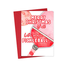 Load image into Gallery viewer, This Pickleball Christmas card from R is for Robo features a delightful watercolor illustration of a pickleball paddle and ball. The card includes the festive message, &quot;Merry Christmas Y&#39;all, Let&#39;s play Pickleball&quot; in red and white lettering. Ideal for pickleball enthusiasts, it comes with a striking red envelope and makes a perfect gift for any pickleball lover.
