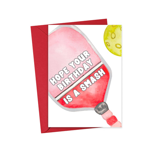 The Pickleball Birthday Card from R is for Robo showcases a humorous design with a red pickleball paddle and a yellow pickleball. The paddle text reads, 