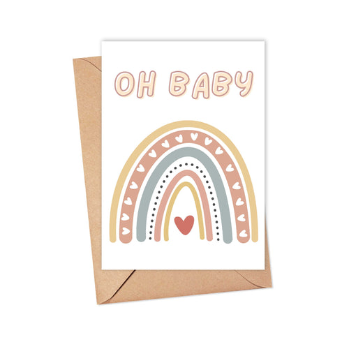 The Oh Baby Boho Rainbow New Baby Card by R is for Robo comes with an envelope and showcases a delightful boho rainbow adorned with heart patterns and pastel-colored 